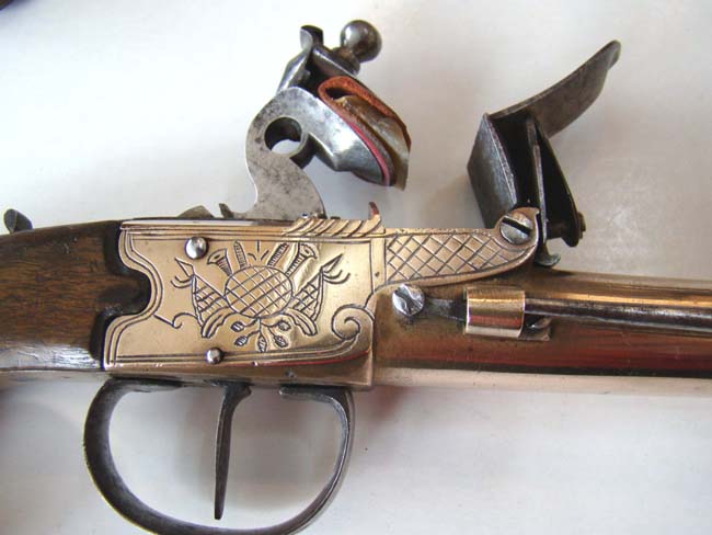 A Unique Large Pair of Unmarked, probably British, Engraved Brass Flintlock Blunderbuss Pistols with snap bayonets. Circa 1780-1800. — image 5
